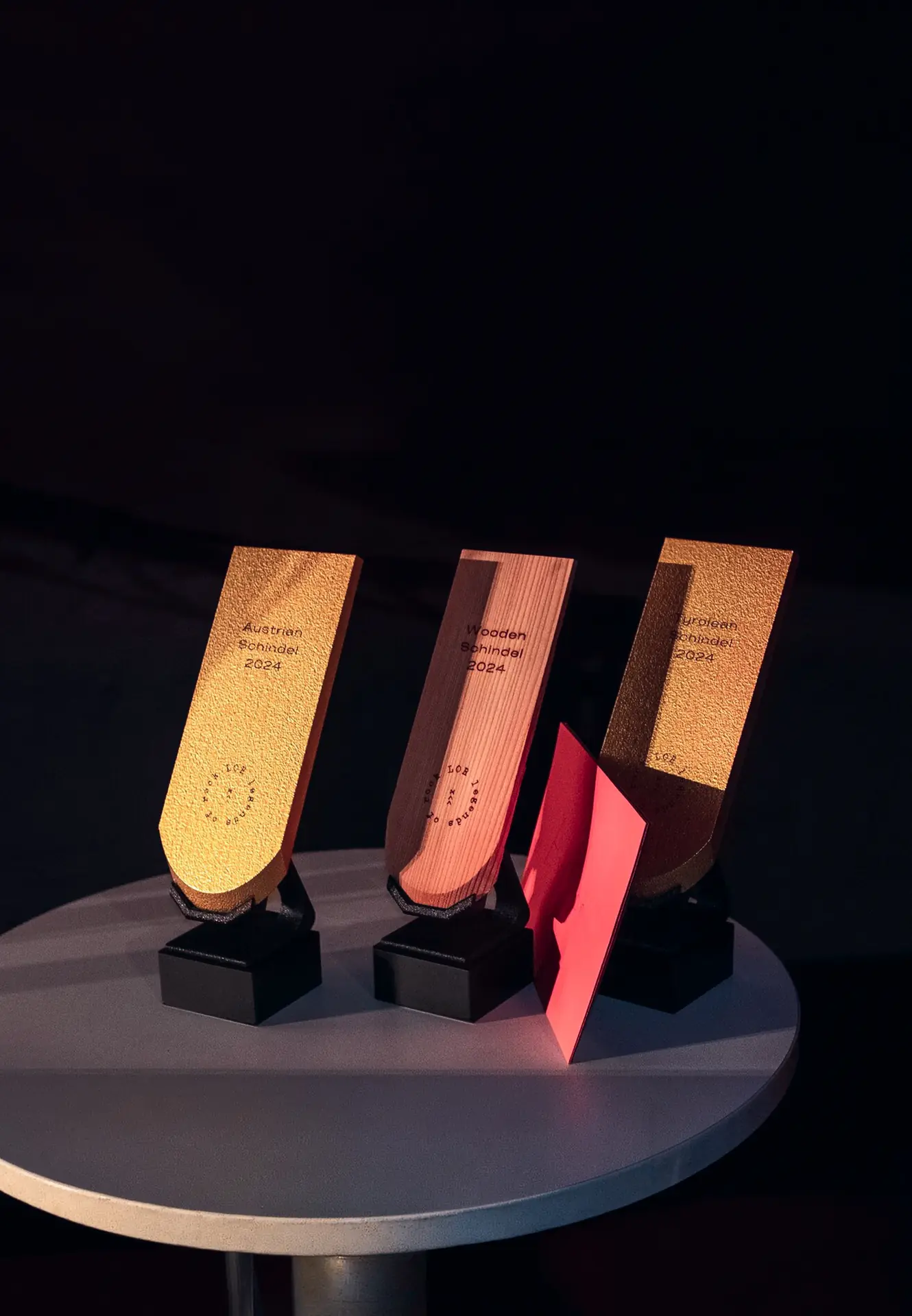 The golden shingle trophies, lined up on a table