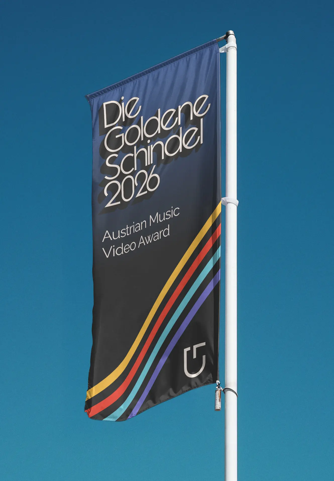 A Die Goldene Schindel flag against a blue sky