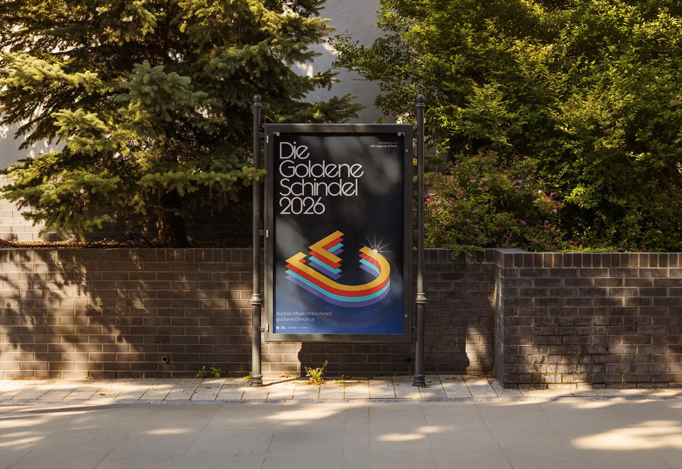 The Die Goldene Schindel 2026 poster on a city light in a park in Innsbruck